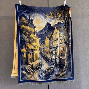 Close-up of oil painting style jacquard pattern and fringe detail on warm scarf