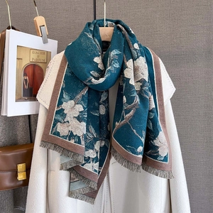 Winter faux cashmere scarf with large white floral print and brown tassels on dark green