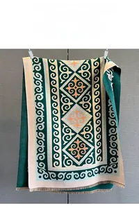Detail of geometric pattern scarf with ethnic print and soft brown fringe tassels