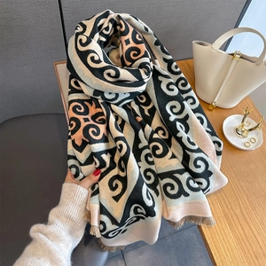 Ethnic geometric pattern shawl with tassels in black and pastel color blocking
