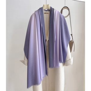 Detail of purple gradient cashmere feel scarf with fringe on white coat