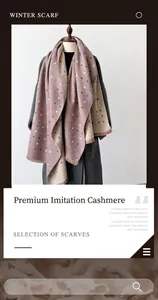 Close-up of thick imitation cashmere scarf featuring colorful heart patterns and short tassels