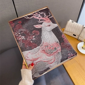 Detailed view of vintage sika deer jacquard texture and premium fabric of the scarf shawl