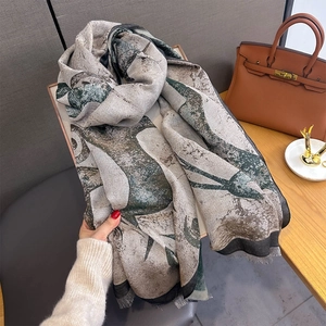 Detail of sika deer jacquard scarf with retro fringe and vintage patterned texture