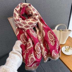 Close-up of paisley pattern pashmina scarf with soft fringe edges and cashmere texture