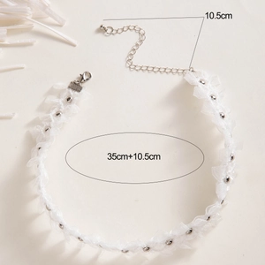 Detailed view of white lace choker necklace with silver beads and adjustable extension chain