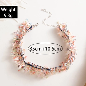 Detail of colorful lace woven choker showing 35cm length plus 10.5cm extension chain
