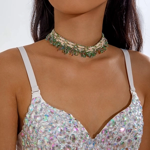Close-up of a bohemian woven choker with colorful beads on a white lace fabric band