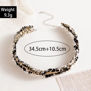 Detail of woven lace choker with dimensions 34.5cm plus 10.5cm extender and 9.3g weight