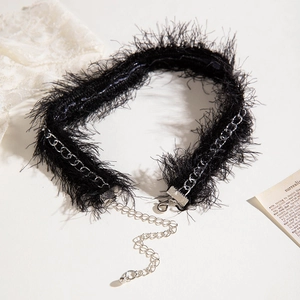 Macro detail of gothic black feather choker with silver lobster clasp and extension chain