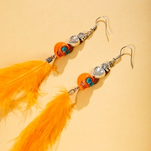 Boucles d'oreilles bohèmes en plumes orange avec breloques cœur et crâne Halloween