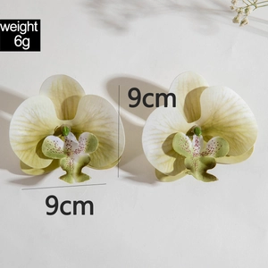Detail of 9cm orchid earrings showing weight 6g and intricate petal textures