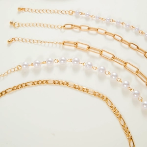 Five-layer gold alloy necklace set featuring pearls and varied chain links for women