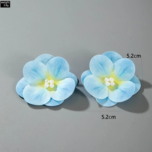 Detailed size view of a 5.2cm blue flower earring with white pearls and 3.9g weight