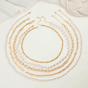 Six-piece layered necklace set with gold chains and white pearls for women