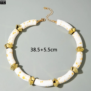 Detail of bohemian acrylic beads with gold texture and adjustable lobster clasp closure