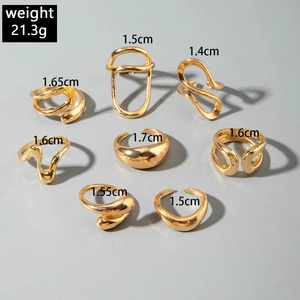 Detail view of 8-piece irregular gold ring set with size labels and 21.3g weight info