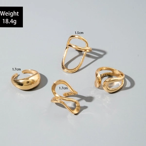 Detail of four-piece gold irregular ring set with weight and size specifications