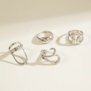 Detailed view of 4-piece minimalist silver irregular hollow and curved open ring set