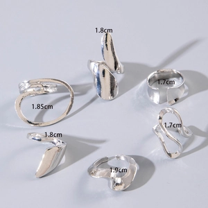 Detail view of irregular silver ring set with size labels from 1.7cm to 1.9cm
