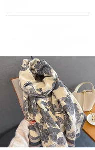 Detail of peony floral print on beige cashmere-like scarf with soft fringe edges