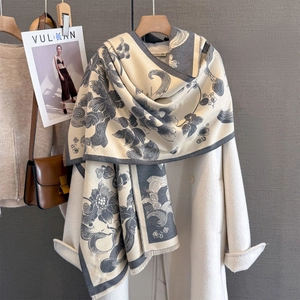 Thick cashmere-like scarf with vintage floral peony print and tassels over a white coat