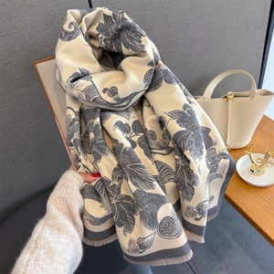 Detailed view of the retro peony floral print and soft fringe trim on the thick shawl scarf