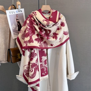 Detail of floral cashmere-like scarf with tassels, featuring retro peony patterns