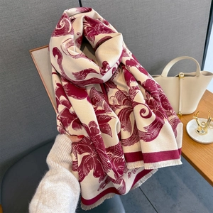 Detail of vintage floral pattern scarf with soft tassels and premium cashmere texture
