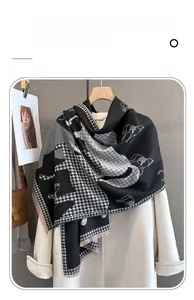 Detail of imitation cashmere scarf with horse print, houndstooth pattern and soft tassels