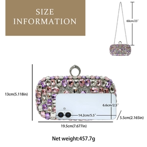 Detail of luxury rhinestones evening clutch with silver ring handle and metal chain strap
