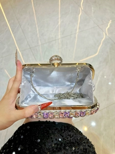 Silver evening clutch bag with rhinestone ring clasp and colorful crystal bottom trim