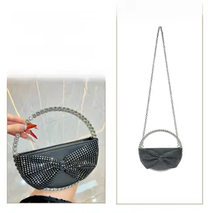Detail of rhinestone bow evening bag showing handbag and cross-body styling options