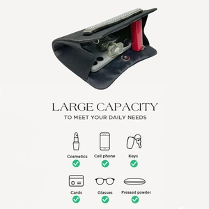 Interior view of black evening clutch bag showing capacity for phone and makeup