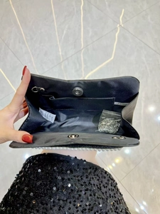 Elegant black satin evening clutch with pearl trim and silver chain strap
