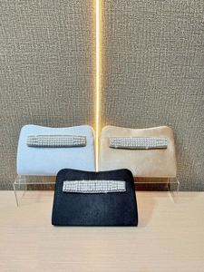 Elegant pearl and rhinestone evening clutch bags in white, gold, and black satin finish