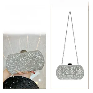 Detail of luxury pearl evening clutch with detachable silver metal chain for cross-body use