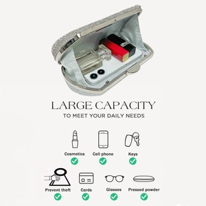 Detailed interior of a silver rhinestone evening clutch showing large capacity and daily essentials