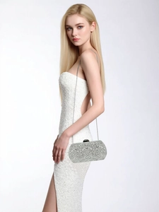 Detailed view of silver evening clutch bag with pearls, rhinestones and silver chain strap