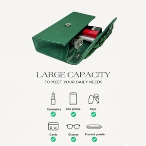 Detail of green satin evening bag interior capacity for phone, keys and cosmetics