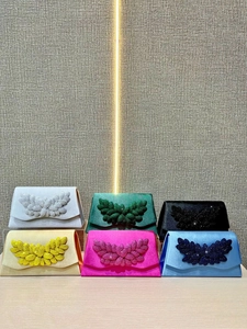 Selection of elegant satin evening clutches in six colors with luxury rhinestone leaf detail