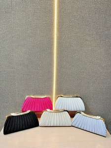 Pleated evening clutch bags in vibrant silk texture with sparkling rhinestone trim