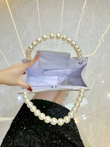 Elegant silver sequin evening bag with large pearl handles and detachable metal chain strap