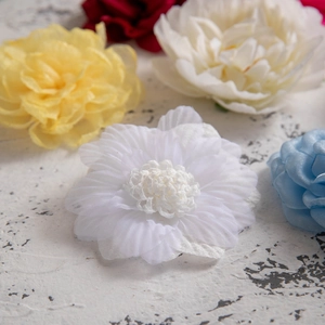 Detail of colorful fabric camellia hair clips with delicate chiffon flower petals