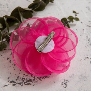 Detail of rose red mesh fabric flower hair clip with silver metal alligator grip