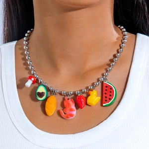 Detail of colorful resin charms including avocado and duck on silver bead chain