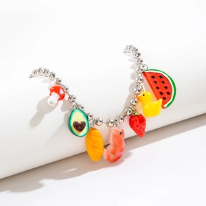 Detail of beaded charm bracelet with colorful resin fruit and animal pendants