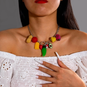 Detailed close-up of Bohemian beaded necklace with colorful fruit and vegetable charms