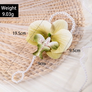 Macro detail of 3D printed orchid finger chain with white pearls and size measurements