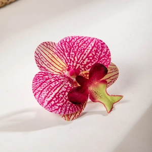 Detail of 3D printed orchid petal textures and soft pink floral patterns with pearl accents